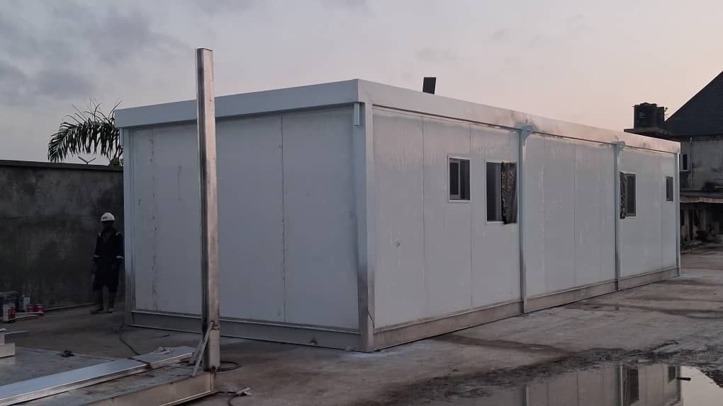 Sleek, fully completed white sandwich-panel module - Proof of clean exterior finish